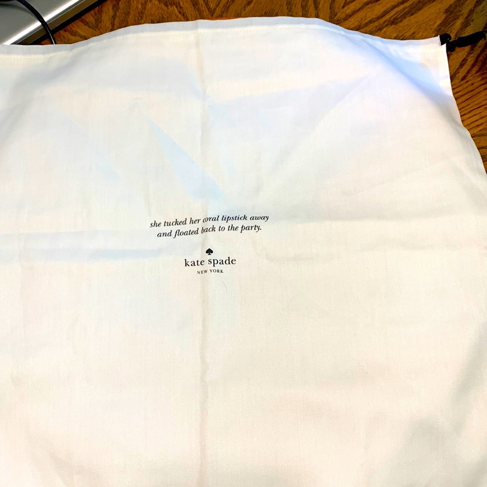 Kate spade large white draw string bag and small brown drawstring bag.